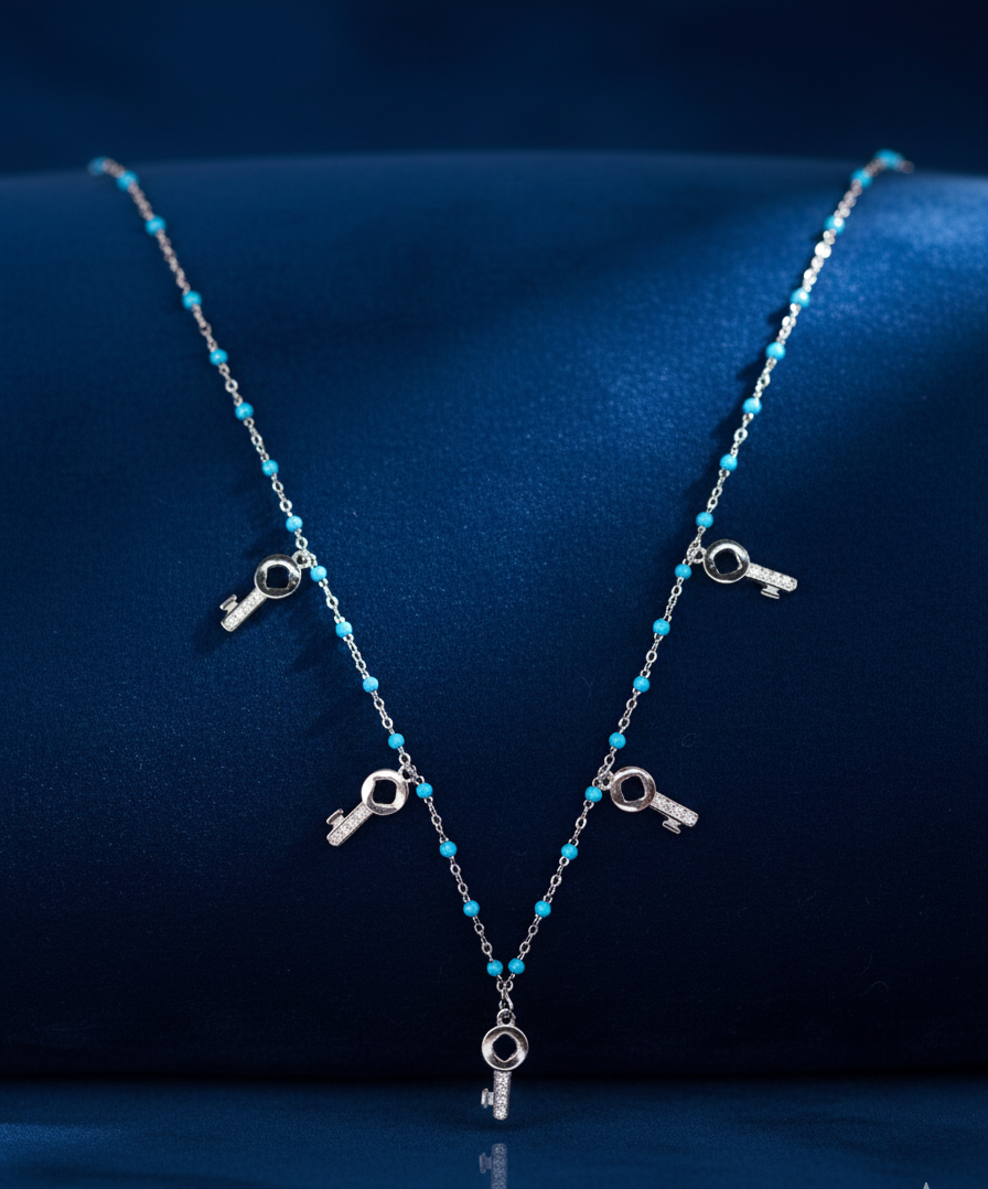 SILVER BLUE CRYSTAL WITH 5 KEY SYMBOL NECKLACE